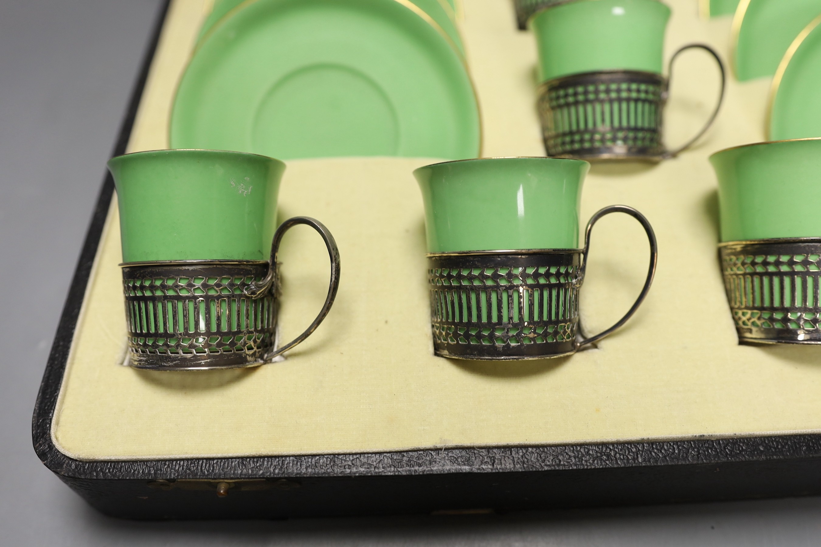 Boxed set of six Shelley 8775/4 green coffee cans and saucers in silver handle mounts